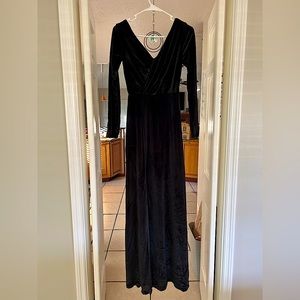 Long velvet black gown with a slit in the leg. Brides maid, formal gown